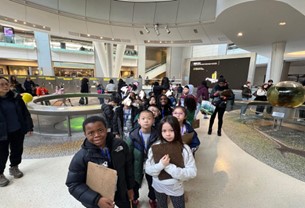 Kids lined up with clipboards